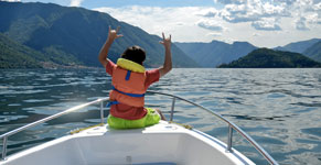 Boy on motorboat on Lake Como